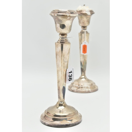 136 - A PAIR OF SILVER CANDLE STICKS, tapered square columns on round weighted bases, hallmarks rubbed 'Sa... 