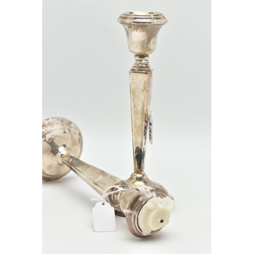 136 - A PAIR OF SILVER CANDLE STICKS, tapered square columns on round weighted bases, hallmarks rubbed 'Sa... 