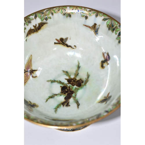 340 - A WEDGWOOD FAIRYLAND LUSTRE PEDESTAL BOWL, designed by Daisy Makeig-Jones, pattern no Z4968, the ext... 