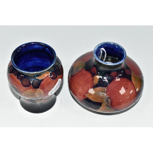 341 - TWO MOORCROFT POTTERY 'POMEGRANATE' PATTERN VASES, each tube-lined with pomegranates, leaves and oth... 