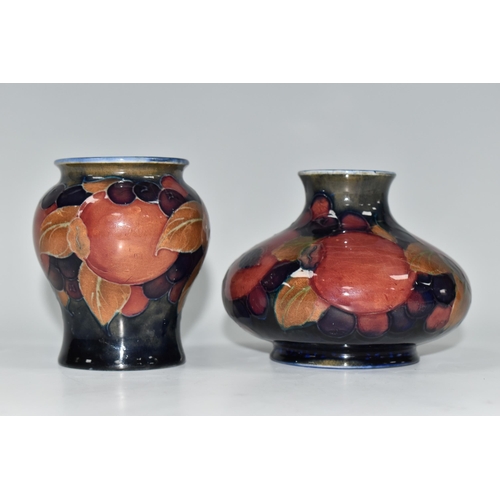 341 - TWO MOORCROFT POTTERY 'POMEGRANATE' PATTERN VASES, each tube-lined with pomegranates, leaves and oth... 