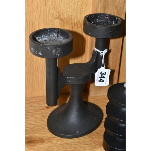 344 - TWO PAIRS OF ROBERT WELCH CAST IRON CANDLE HOLDERS, comprising a pair of double candle holders and a... 