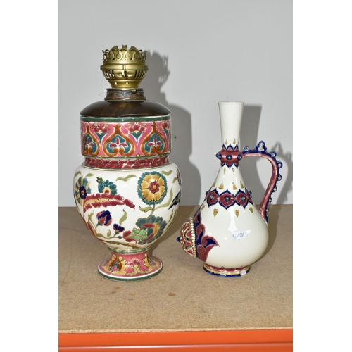 350 - A ZSOLNAY PORCELAIN OIL LAMP BASE AND RETICULATED ZSOLNAY VASE, the oil lamp is painted with an Orie... 