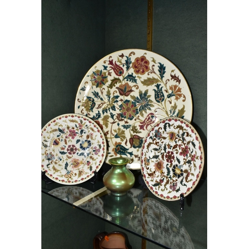 375 - FOUR PIECES OF ZSOLNAY CERAMICS, comprising a florally decorated charger, diameter 38cm, impressed a... 