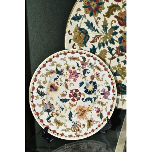 375 - FOUR PIECES OF ZSOLNAY CERAMICS, comprising a florally decorated charger, diameter 38cm, impressed a... 