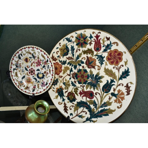 375 - FOUR PIECES OF ZSOLNAY CERAMICS, comprising a florally decorated charger, diameter 38cm, impressed a... 