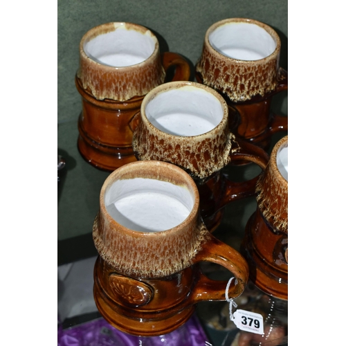 379 - FIVE ZSOLNAY STONEWARE TANKARDS, designed by Gyorgy Furtos, each decorated with an applied panel  em... 