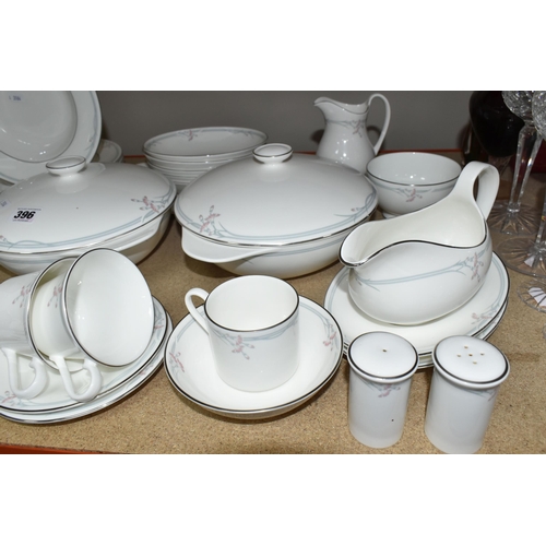 396 - A ROYAL DOULTON 'CARNATION' PATTERN DINNER SET, comprising two covered tureens, an oval meat plate, ... 