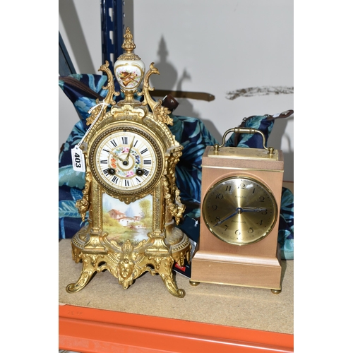 403 - A FRENCH STYLE GILT METAL MANTEL CLOCK, with hand painted porcelain dial and front panel, eight day ... 