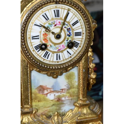 403 - A FRENCH STYLE GILT METAL MANTEL CLOCK, with hand painted porcelain dial and front panel, eight day ... 