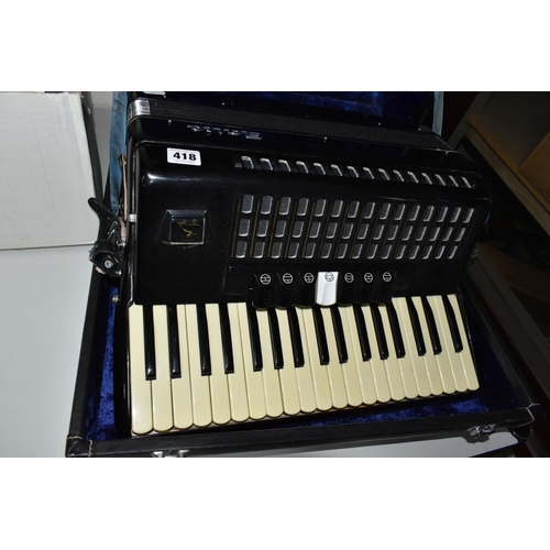 418 - A CASED BAILE ACCORDION, in gloss black, with eighty buttons, thirty seven keys and seven tone switc... 