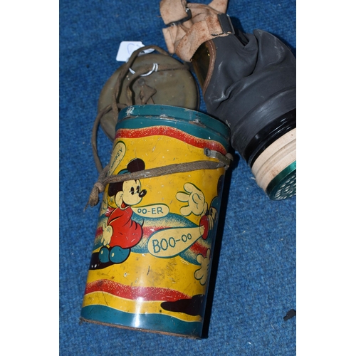 427 - A MICKEY MOUSE GAS MASK CASE, multi-coloured lithographed tinplate case with lid, showing Mickey wea... 