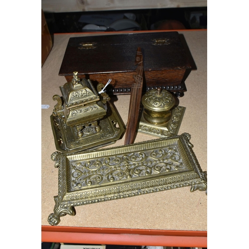 428 - A GROUP OF DESK ITEMS, comprising two brass inkwells, one of Oriental style, having a finial in the ... 