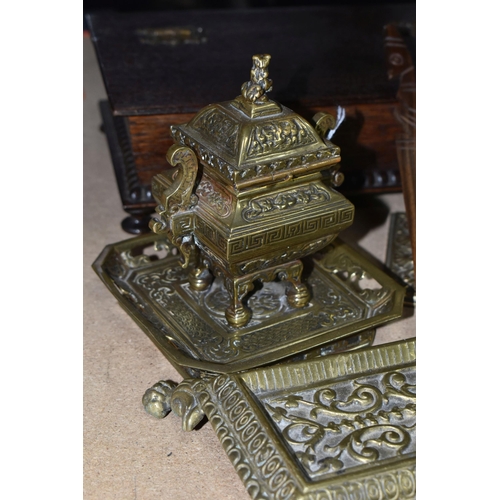 428 - A GROUP OF DESK ITEMS, comprising two brass inkwells, one of Oriental style, having a finial in the ... 