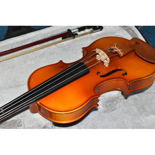 429 - A CASED HALF SIZE VIOLIN, having a two piece back, length 51cm, the bow having mother of pearl eyes ... 