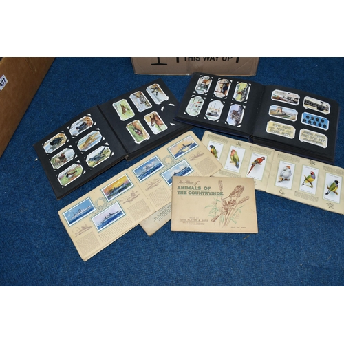 431 - A QUANTITY OF ASSORTED CIGARETTE CARDS, loose, loosely inserted and stuck into albums, majority are ... 