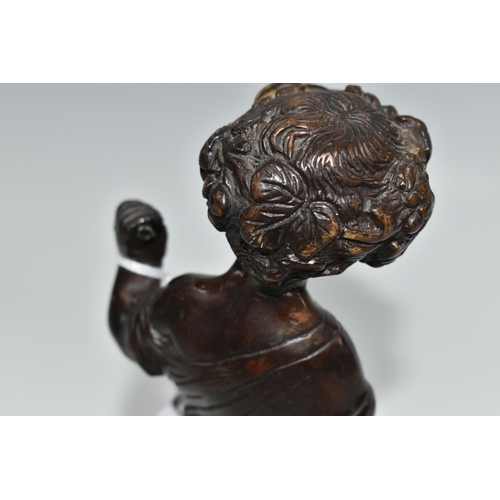 441 - A BRONZE HARVEST PUTTO FIGURE, the figure wearing a garland of vine leaves and grapes, standing amon... 