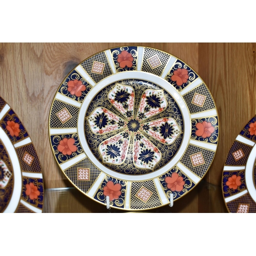 443 - THREE ROYAL CROWN DERBY IMARI 1128 PLATES, one 21.5cm diameter tea plate, and two 16cm side plates (... 