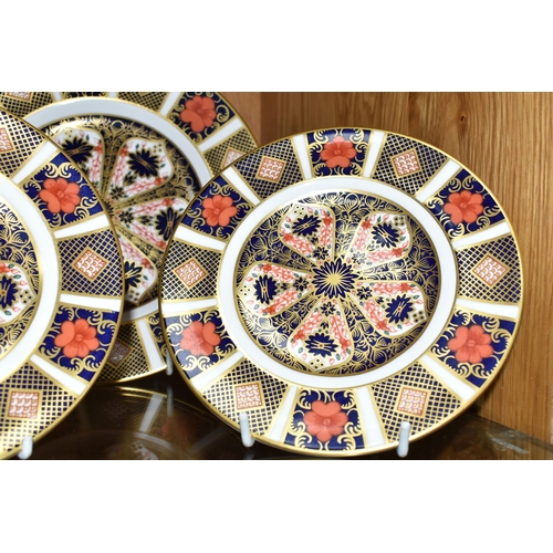 443 - THREE ROYAL CROWN DERBY IMARI 1128 PLATES, one 21.5cm diameter tea plate, and two 16cm side plates (... 