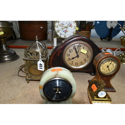 451 - A GROUP OF CLOCKS, comprising an electric gilt metal lantern clock, a small 'balloon' clock, an Art ... 