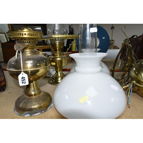 452 - A QUANTITY OF BRASS LIGHT FITTINGS AND CHANDELIERS, comprising a five arm and three arm brass chande... 