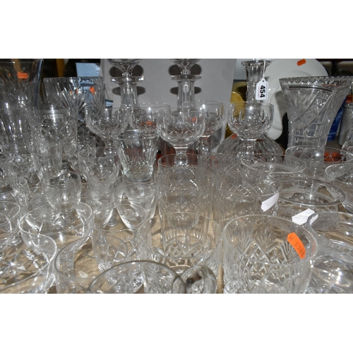 454 - A QUANTITY OF CUT CRYSTAL AND GLASSWARE, comprising four decanters, five vases, two celery vases, a ... 