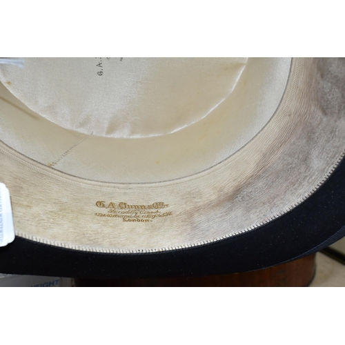 479 - A VINTAGE G.A.DUNN & CO LTD. TOP HAT, with a metal hat box, together with a boxed set of Henselite S... 