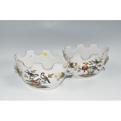 505 - A PAIR OF LATE 19TH / EARLY 20TH CENTURY CONTINENTAL PORCELAIN TWIN HANDLED CACHE-POT PLANTERS, the ... 