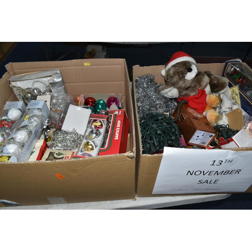 555 - TWO BOXES OF CHRISTMAS DECORATIONS, including baubles, lights and soft toys (2 boxes)