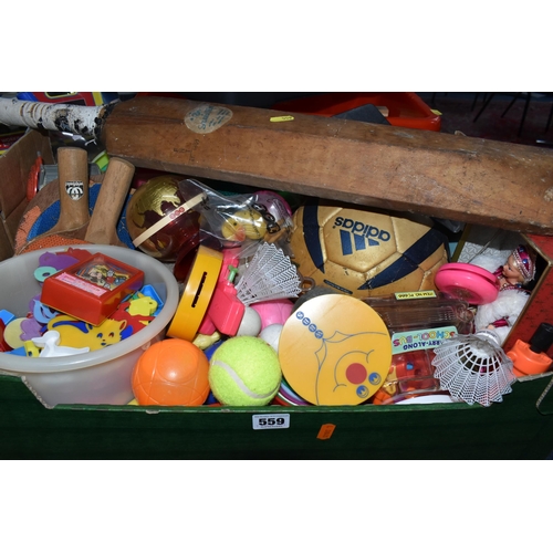 559 - FIVE BOXES AND LOOSE TOYS AND SPORTING EQUIPMENT, ETC, including a push along / sit on dog (a.f.), a... 