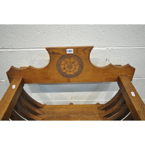 1198 - A 20TH CENTURY OAK SAVONAROLA CHAIR, the detachable back rest with floral central crest, X framed su... 