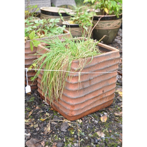 1014 - A PAIR OF TERRACOTTA RIBBED SQUARE PLANTERS, 36cm squared x height 35cm, and a pair of circular terr... 