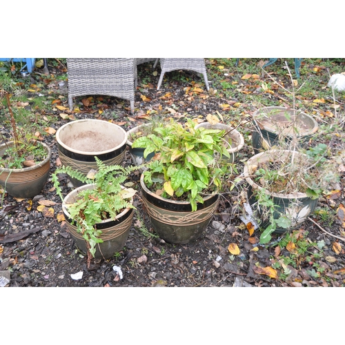 1019 - A SET OF EIGHT GREEN GLAZED PLANT POTS, of various sizes, including a set of four and a set of three... 