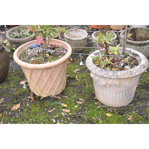 1030 - A TERRACOTTA CIRCULAR PLANTER, with a lattice design to the side, diameter 59cm x height 46cm, along... 