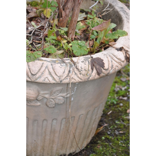 1030 - A TERRACOTTA CIRCULAR PLANTER, with a lattice design to the side, diameter 59cm x height 46cm, along... 