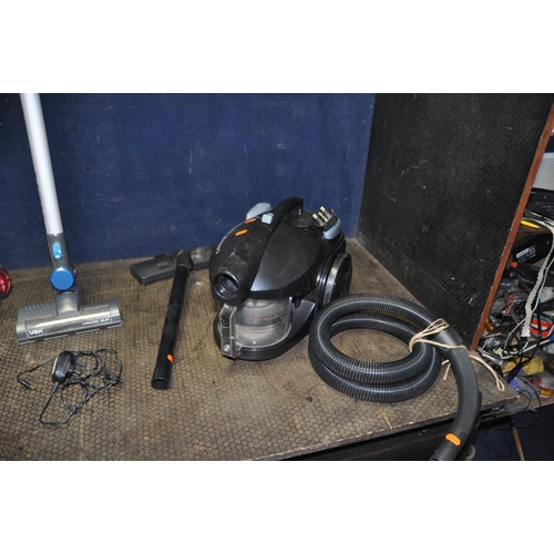 1051 - THREE VACUUM CLEANERS comprising of a Vax cordless with power supply, a Dirt Devil upright  and a Te... 