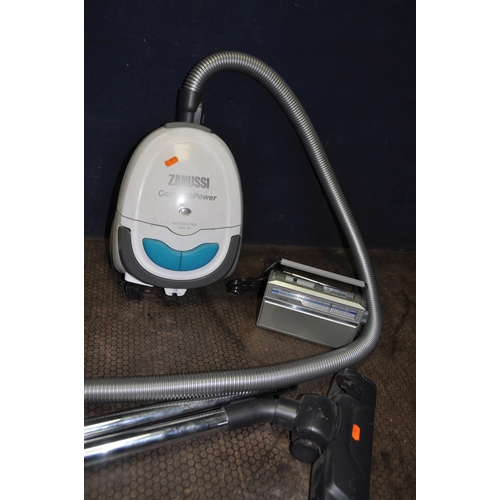 1094 - A ZANUSSI COMPACT POWER VACUUM CLEANER, a Ferguson Radiostar portable radio (both PAT pass and worki... 