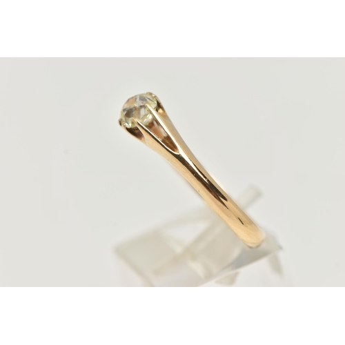 10 - A SINGLE STONE DIAMOND RING, the old mine cut diamond in an eight claw setting to the bifurcated sho... 