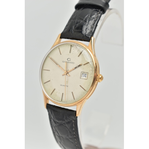 2 - A 9CT GOLD GARRARD WRISTWATCH, with quartz movement, circular gold coloured dial signed Garrard Quar... 