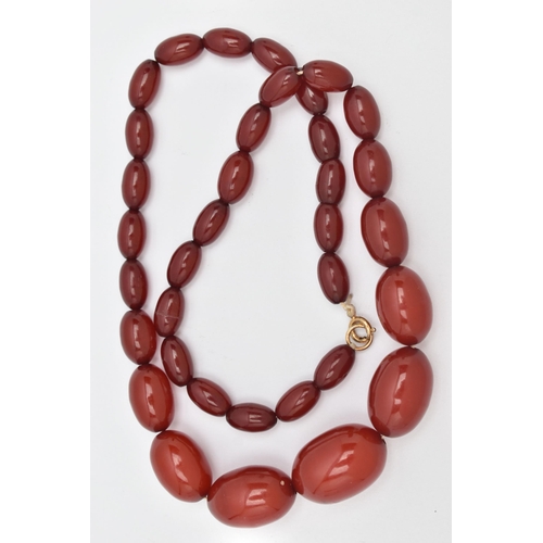 20 - A BAKELITE BEAD NECKLACE, comprising of thirty-five graduated oval shape beads measuring approximate... 