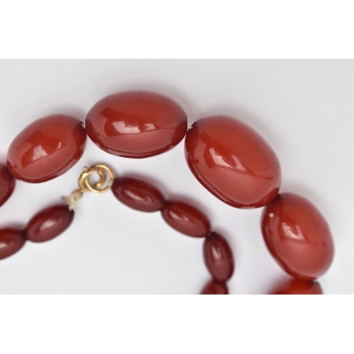 20 - A BAKELITE BEAD NECKLACE, comprising of thirty-five graduated oval shape beads measuring approximate... 