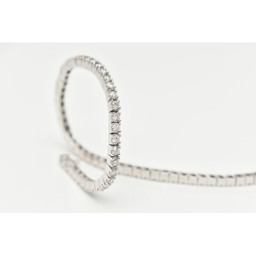 23 - A 9CT WHITE GOLD DIAMOND LINE BRACELET, designed as sixty-four round brilliant cut diamonds each wit... 