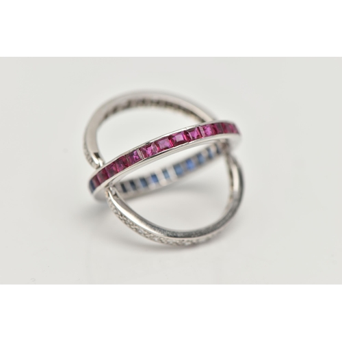 36 - A WHITE METAL 'DAY AND NIGHT' GEM SET RING, designed with a band of half square cut rubies and half ... 