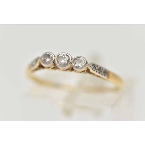 4 - AN 18CT GOLD THREE STONE DIAMOND RING, designed as three graduated round brilliant cut diamonds in c... 