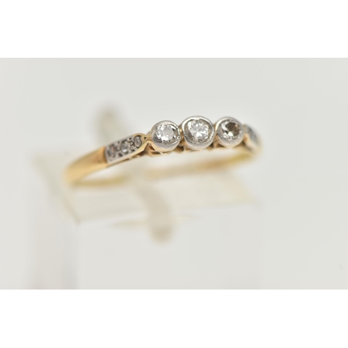 4 - AN 18CT GOLD THREE STONE DIAMOND RING, designed as three graduated round brilliant cut diamonds in c... 