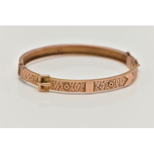 40 - A LATE VICTORIAN 9CT ROSE GOLD HINGED BANGLE, belt and buckle design with ivy leaf detail, fitted wi... 