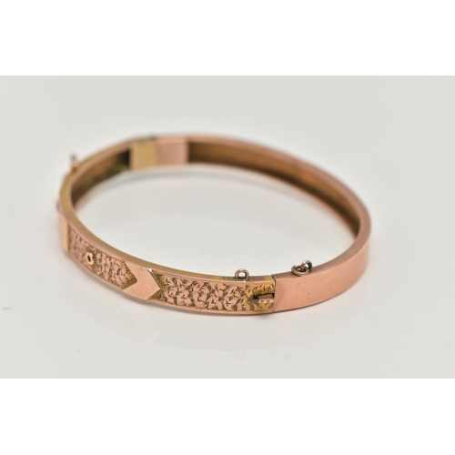 40 - A LATE VICTORIAN 9CT ROSE GOLD HINGED BANGLE, belt and buckle design with ivy leaf detail, fitted wi... 