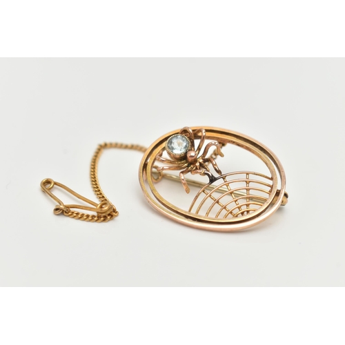 63 - AN EARLY 20TH CENTURY SPIDER BROOCH, of an oval outline, featuring an open work spider web design an... 