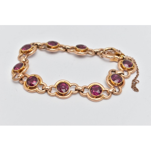 64 - A RHODOLITE GARNET LINE BRACELET, designed as a series of nine open work links, each set with a circ... 