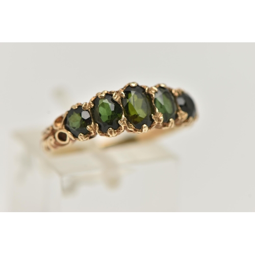 69 - A 9CT GOLD GREEN TOURMALINE RING, designed as a row of three oval cut tourmaline, and two circular c... 